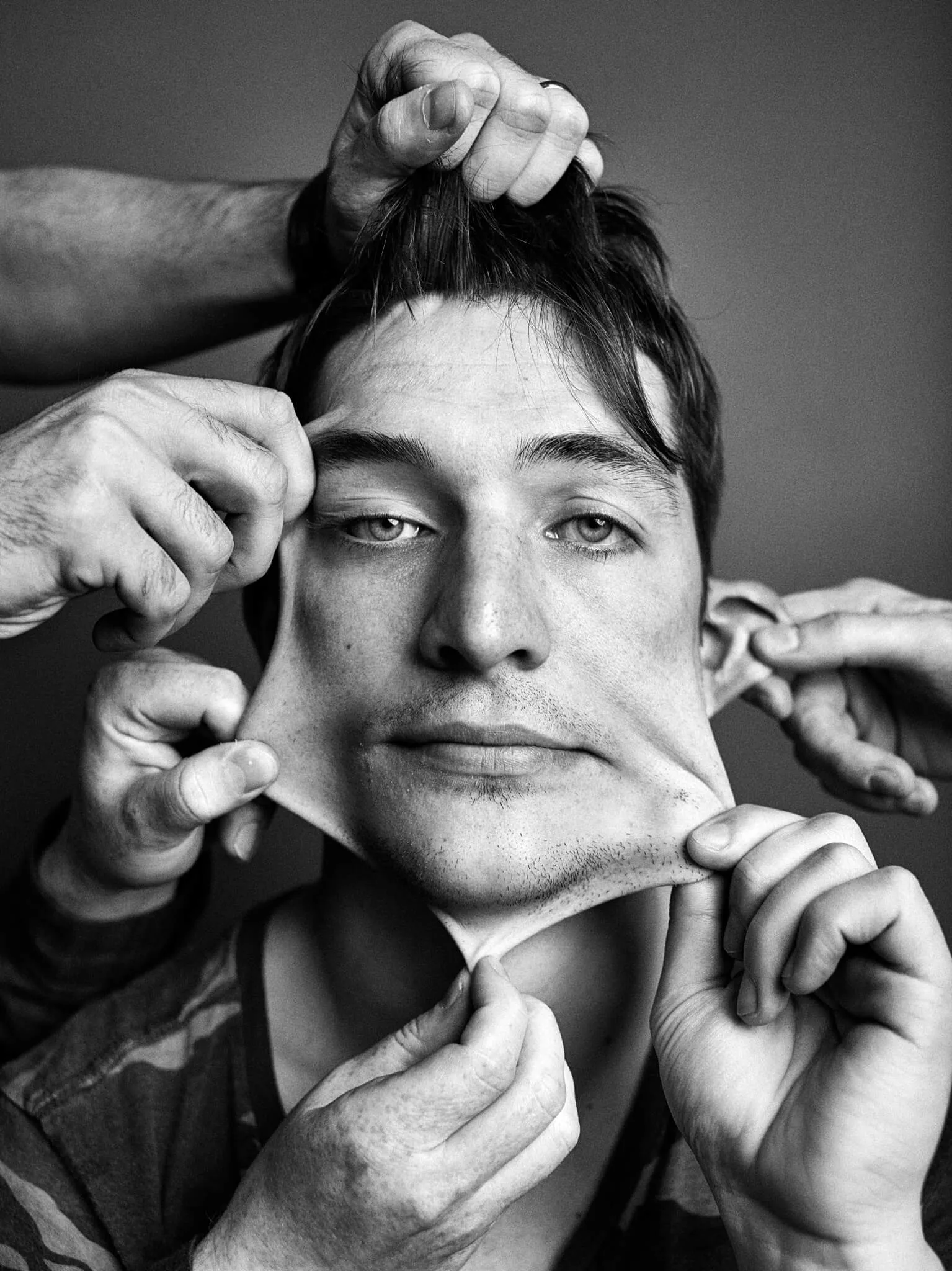 Erik Peterson, with his bandmates stretching his face in every direction